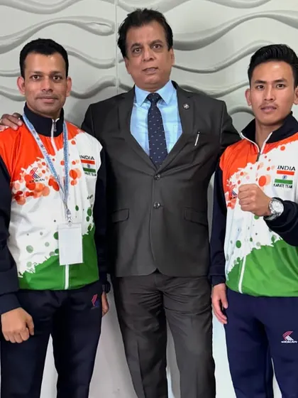Standing with the men's team at the Commonwealth Karate Championship. Their success is a result of the robust training and competition structure we have built.