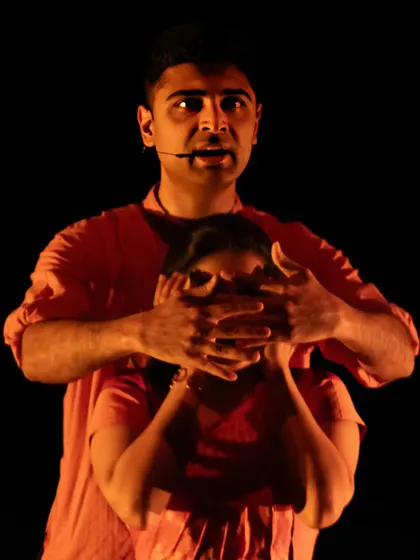 A powerful theatrical moment from *Abandhana*. The piece is a true collaboration, with musicians physically interacting on stage to represent the forces that both bind and liberate the central character.
