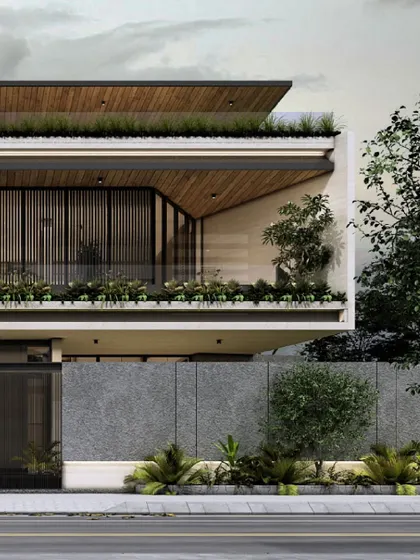 'The Trapezoidal House' in Raichur is a modern minimalist residence integrating concrete, glass, and wood. This view shows the cantilevered upper floor and the lush rooftop terrace, which fosters a dialogue between the built space and nature.