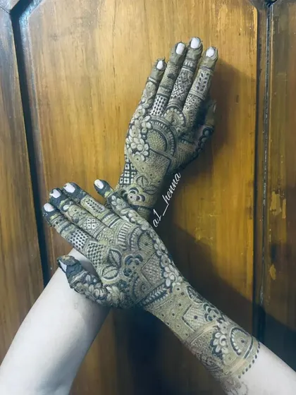 A stylish pose showing a detailed design against a wooden background.