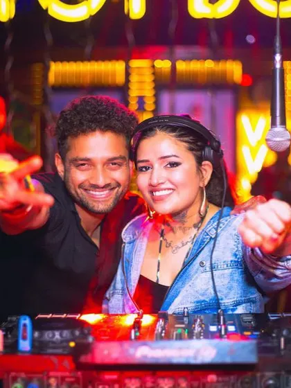 Posing for a picture with a guest during my set.