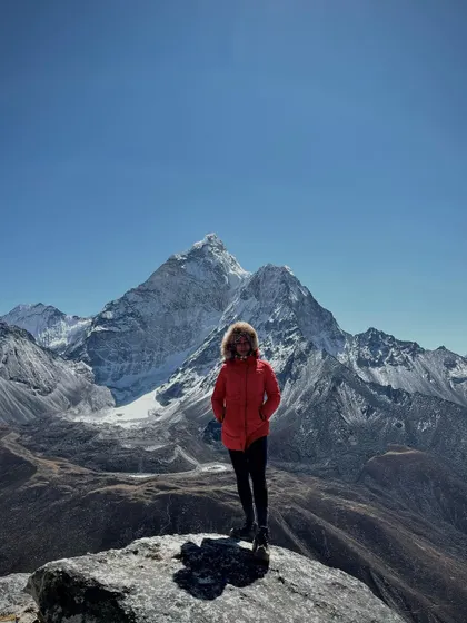 The climb is tough, but the view from the top is always worth it. This photo was taken against the stunning backdrop of Ama Dablam, a moment of peace and accomplishment during the Everest Base Camp trek.