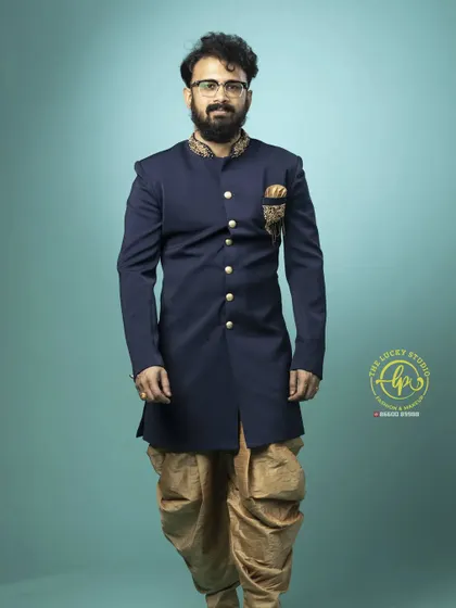 A full-length view of the navy blue Jodhpuri suit, showing its sharp tailoring and elegant design.