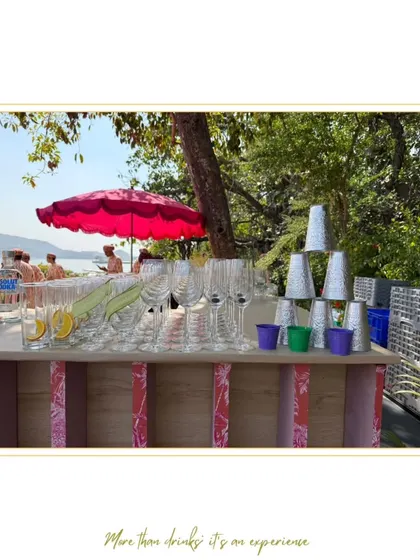 A beautiful bar setup for a brunch party, with glassware and drinks ready for a sunny celebration.