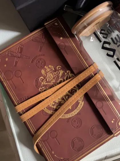 A close-up of the beautifully detailed, leather-feel journal included in the Harry Potter hamper.