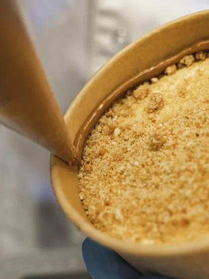The final touch for our Banoffee Pie: a drizzle of rich toffee sauce.