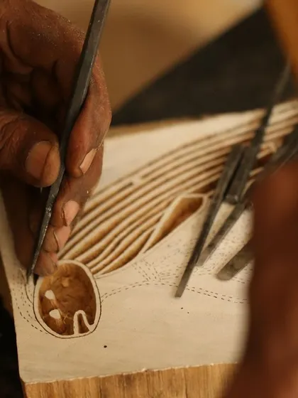 This is the story of a Yawkyawk (young woman mermaid) design by artist Janet Marawarr. Her original lino tile is being carefully translated into a woodblock by our carvers, preserving the story for our collaborative textile collection.