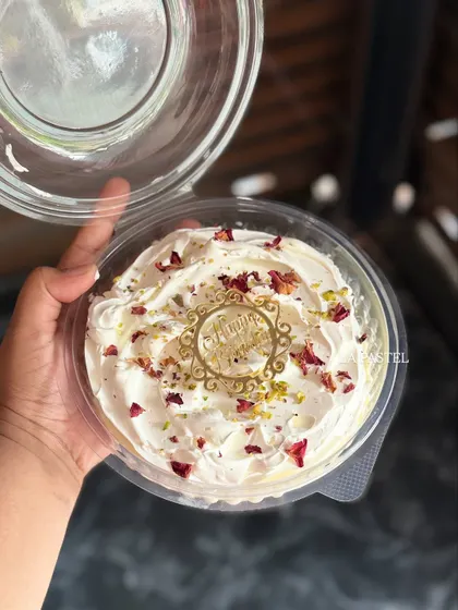 Holding up the XXL Tres Leches tub to show its generous size. It's a crowd-pleaser for sure!