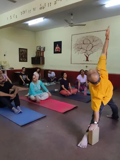 Leading a class for dancers, focusing on asanas that build strength and flexibility. Yoga is a powerful complementary practice for any physical discipline.