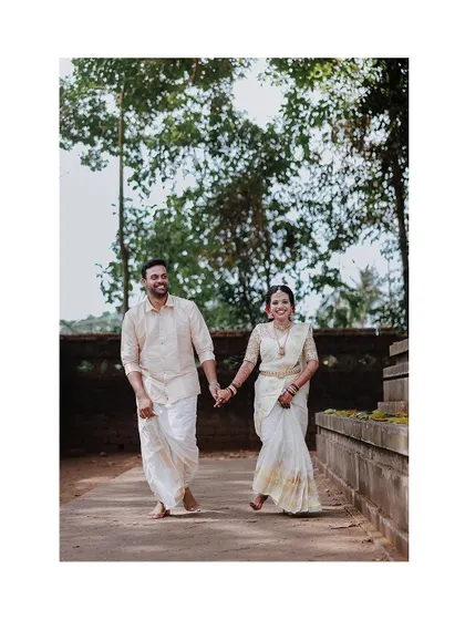 A beautiful shot of a couple walking hand-in-hand, a perfect representation of their new journey together.