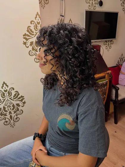 A side view showing the layers that give her curls shape and movement.