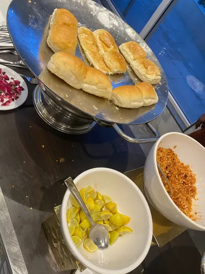 Soft pav bread, lightly toasted and ready to be paired with our flavorful bhaji, along with lemon and dry garlic chutney.