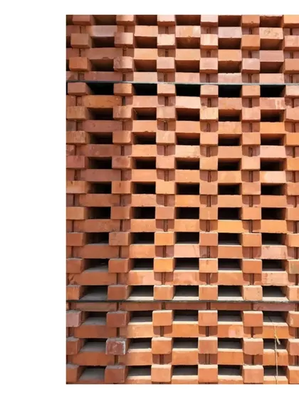 A close up of the brick jali at our Ishtika house. The pattern of light and shadow created by the perforated wall is a key feature of the design, allowing the building to breathe while maintaining privacy.
