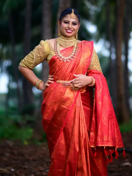 A confident pose from a model wearing our mango-mala style bridal set. Renting allows you to wear such grand designs for your special day.