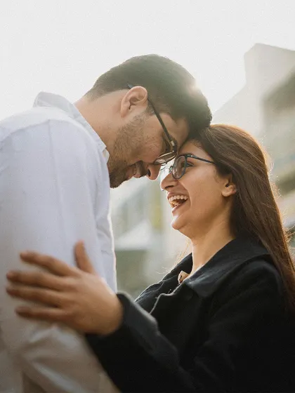 Laughter and love in the heart of the city. This candid shot from a Delhi pre-wedding session shows that the most powerful moments are often the most natural ones.
