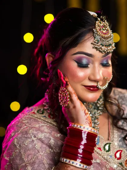 A beautiful closed-eye shot, showing the seamless blend of the eyeshadow and the glowing highlighter on the cheekbones.