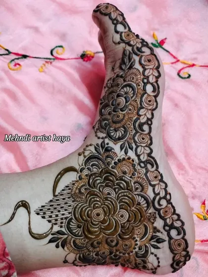 A stunning foot design featuring a large, intricate flower and a swan motif, combining grace and beauty.
