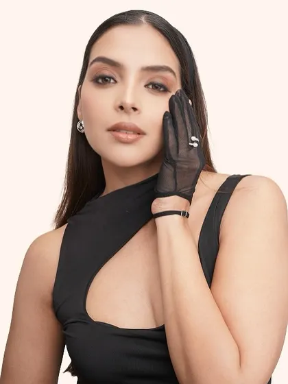 The soft glam makeup gives a timeless feel to this modern, fashion-forward shot.
