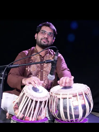 A pensive moment during a photoshoot. For me, playing the tabla is a meditative experience, a way to connect with a deeper part of myself and the music.