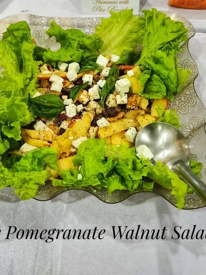 A close-up of my Apple Pomegranate Walnut Salad, a fresh and crunchy option that adds a healthy balance to any party menu.