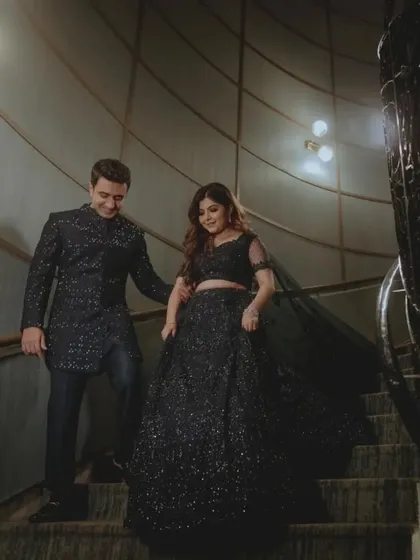 The couple descending the stairs, a classic and elegant shot.