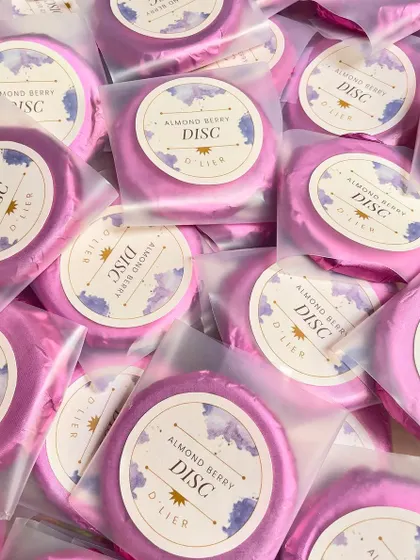 A sea of our beautifully wrapped Almond Berry Discs, ready to be sent out for a large order. We ensure consistent quality and presentation for every single piece.