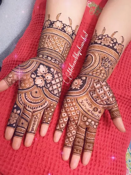 A full view of the Karwa Chauth design, showing the beautiful symmetry and intricate details on both hands.
