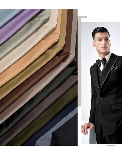We offer a huge collection of men's suit fabrics. This image pairs a selection of our colorful, premium materials with a finished classic black tuxedo.