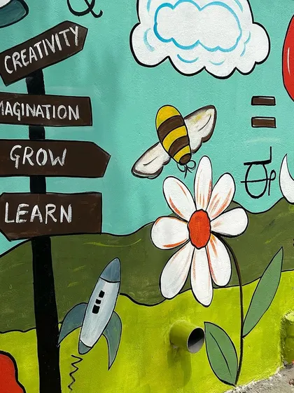 Another detail from the school mural, showing a hot air balloon, a bee, and a rocket ship. I used a simple, cartoonish style that is appealing to young children.