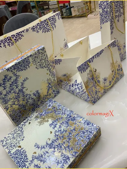 A full set of our blue and white floral-print packaging, including gift boxes and matching paper bags. This allows for a completely coordinated gifting experience.