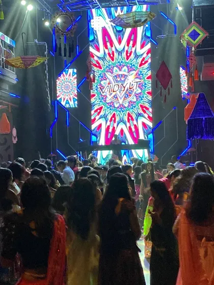 A shot from the back of the venue, showing the scale of the Navratri celebration. The entire club is transformed with themed decorations and my VDJ setup.