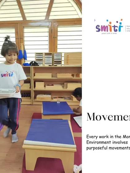 Purposeful movement is integrated into every activity, like this child carefully carrying a tray to her workspace. This helps develop coordination, balance, and a sense of order.