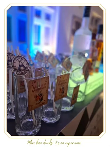Custom glassware tags with clock motifs for the Wonderland party. These small, thematic details are what make our bar experiences truly special and immersive.