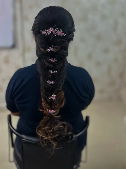 A full back view of the long, flowing mermaid braid with floral details.