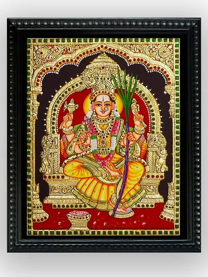 The framed version of our Lalitha Devi Tanjore painting. The elegant black frame provides a beautiful contrast to the rich colors and gold of the artwork, making it a complete piece ready for your wall.