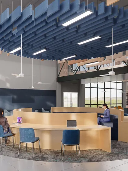A circular study area within the Amity University library in Hyderabad. The suspended acoustic ceiling feature helps define the zone and manage sound, creating a focused space for collaboration.