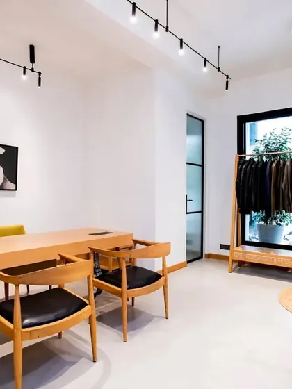 This zen-inspired office uses our Magnetic Modular Lighting System to achieve a clean, minimalist aesthetic. The track lights provide focused illumination on the desk and clothing rack, maintaining an open and uncluttered feel in line with the Wabi Sabi design philosophy.