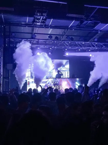 A wide view of the party at Waters, Pune. The custom neon signs and CO2 jets show how I can enhance a venue's existing setup.