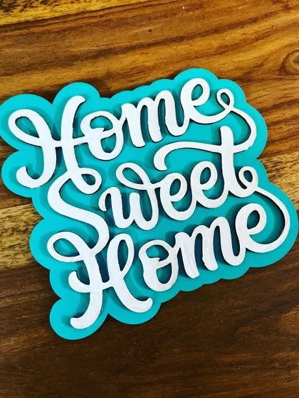 Adorn your cozy space with this "Home Sweet Home" handmade fridge magnet. It's a lovely little reminder of what matters most.