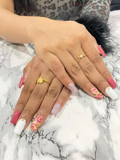 A romantic set combining solid white, pink, and glitter nails with beautiful, hand-painted rose accent nails.