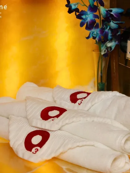 Fresh, clean towels with our signature logo are always available, reflecting our commitment to providing a premium and hygienic service.