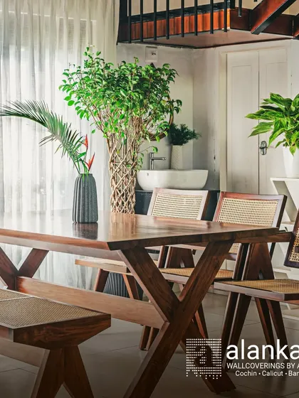 This dining set is a perfect example of my handcrafted excellence. The solid teak wood table with its cross-leg design, paired with matching chairs and a bench featuring intricate cane work, creates a warm and inviting space for family gatherings.