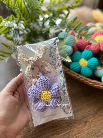 A purple puff flower keychain in its gift packaging. We can customize the cards for any occasion, making them great for wedding favors, return gifts, or corporate gifting.
