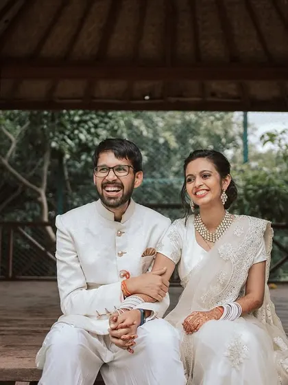 Another joyful, candid shot of the couple, capturing the happiness of their wedding day.