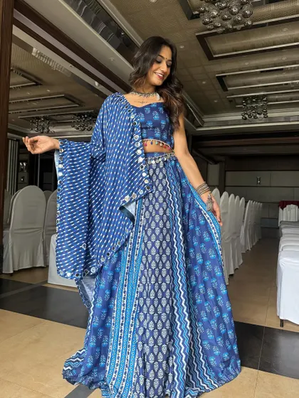 A full-length view of this stunning Navratri outfit. The makeup is designed to be both beautiful and long-lasting for a night of dancing and festivities.