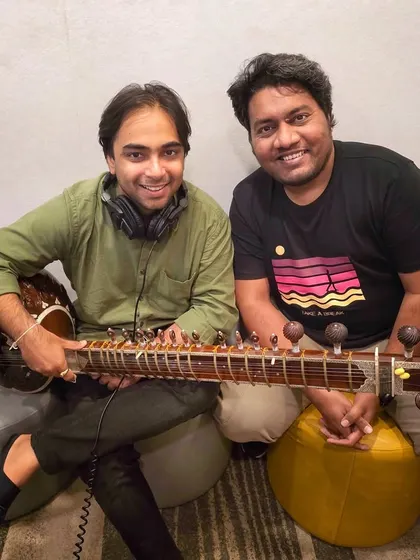 In the studio recording a sitar piece for a Visa ad film with composer Santosh Jagdale. I am experienced in delivering professional, high-quality tracks for major brands and advertising campaigns.