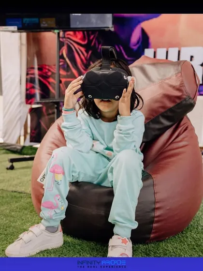 Even our youngest gamers can get in on the fun. A child sits comfortably on a bean bag while exploring a safe and exciting virtual world.