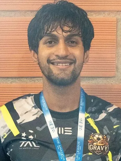A portrait of one of our senior players with his runners-up medal. I am proud of the dedication each player shows to the team and the sport.