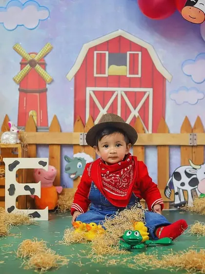 Dressed up and ready for his farm-themed party. The little hat and bandana complete this adorable cowboy look.