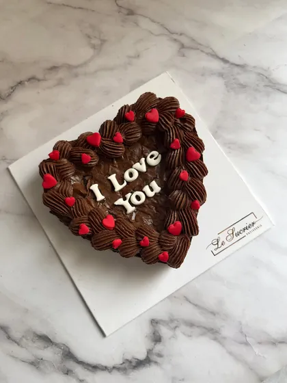 My bestselling Belgian chocolate brownie in a heart shape, topped with rich ganache and a simple "I Love You" message for Valentine's Day.